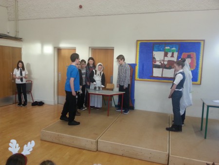 "A Christmas Carol" - The Ghost (Tegan) takes Scrooge (Lorna) to watch The Cratchit Family.